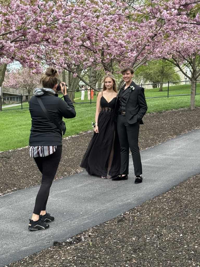 Photographer Betsy capturing moments during photo session